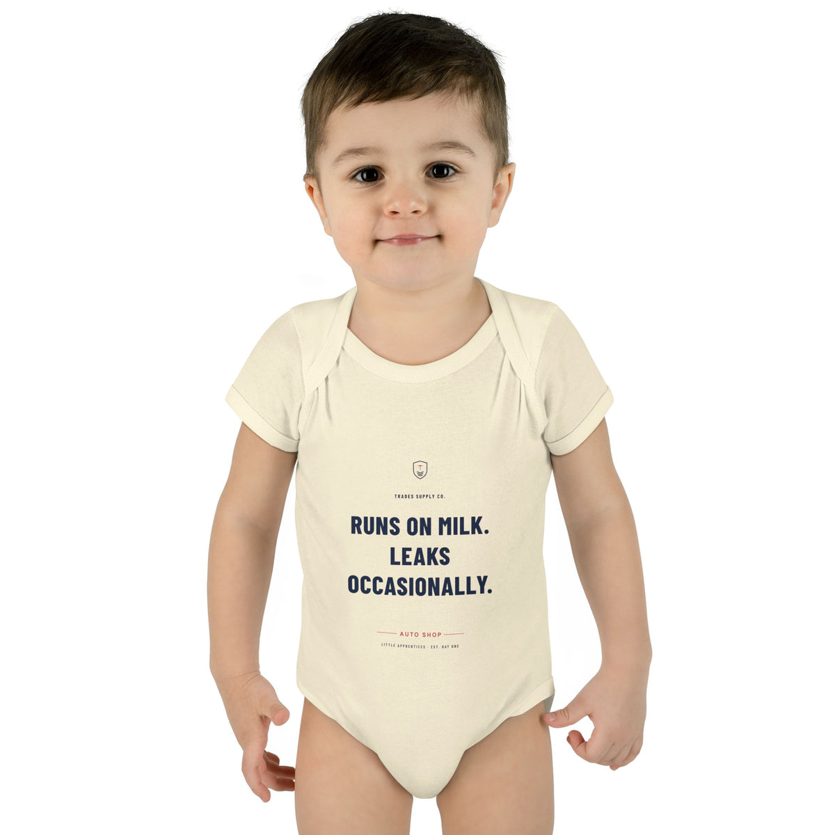 Runs On Milk. Leaks Occasionally. — Auto Tech Baby Bodysuit