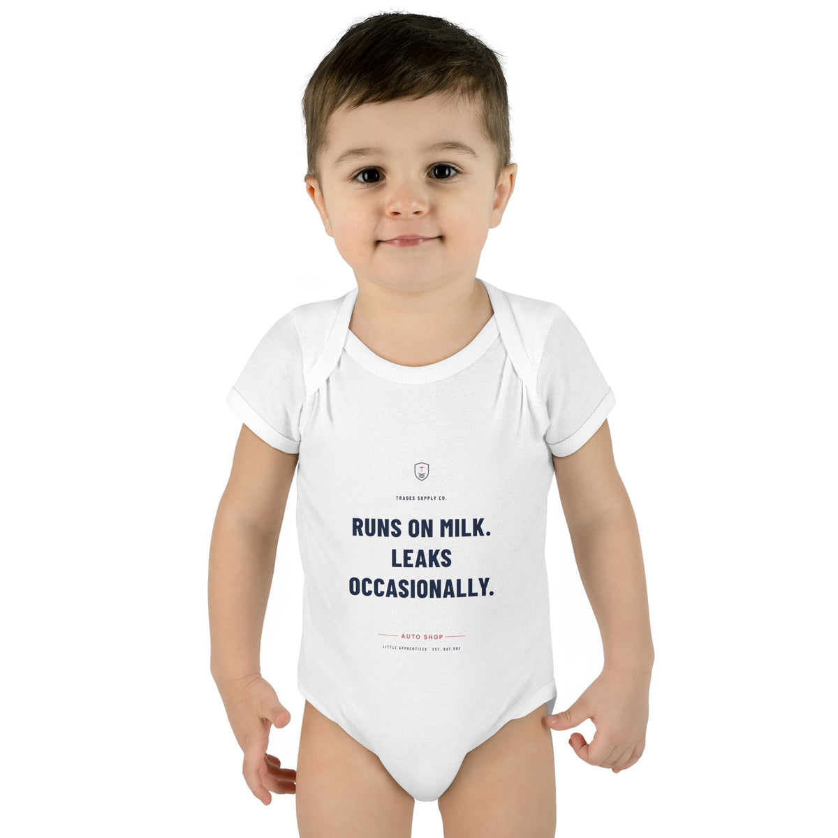 Runs On Milk. Leaks Occasionally. — Auto Tech Baby Bodysuit